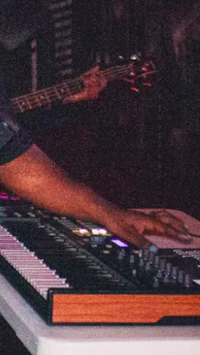 a man playing a keyboard at a concert