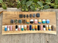a wooden board with a variety of stones on it