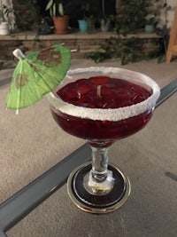 a martini glass with an umbrella on it