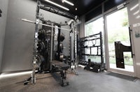 a gym room with a lot of equipment