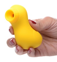 a person holding a yellow rubber duck toy