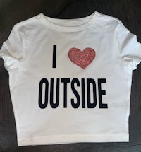 a white t - shirt that says i love outside
