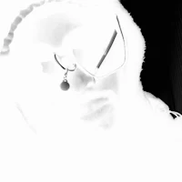 a black and white photo of a person wearing glasses