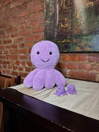 a purple octopus sitting on a table