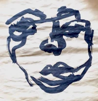 a drawing of a face on a piece of paper