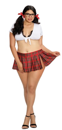 a woman in a plaid skirt and glasses is posing for a photo