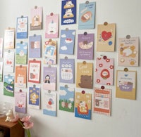 a room with a lot of kawaii cards on the wall