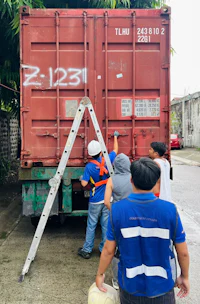 a group of people standing next to a truck