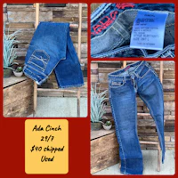 a pair of jeans with a tag on them