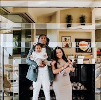 a family posing for a picture in front of a fireplace