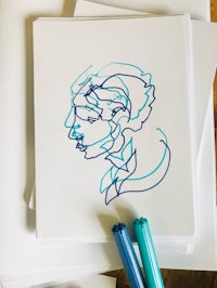 a drawing of a woman on a piece of paper
