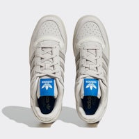 a pair of white and blue adidas sneakers