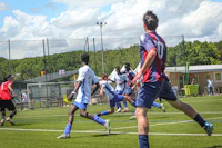 a group of people playing soccer on a field