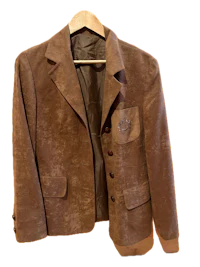 a brown blazer hanging on a hanger