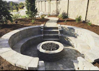 a circular fire pit in a backyard
