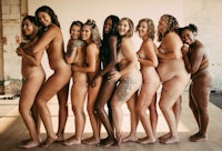 a group of naked women posing for a photo