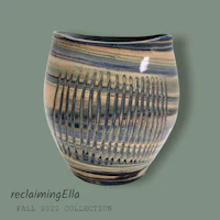 a vase with a striped pattern on it