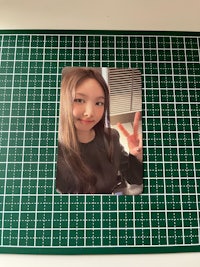 a girl in a plaid shirt is posing for a photo