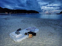 a bed on the beach at night