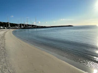 a view of a beach with a boat in the water