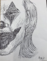 a drawing of a clown face