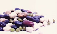 a pile of beans and peas on a white background