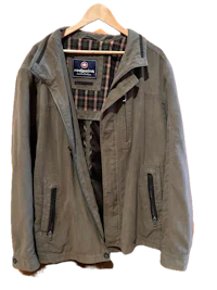 a men's jacket hanging on a hanger