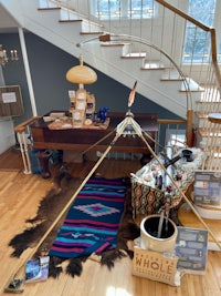 a room with a teepee and other items