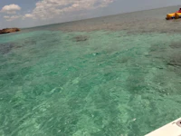 a boat in the water with a raft in the water