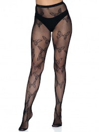 a woman in black stockings with butterflies on them