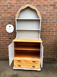 a white and grey hutch with a wooden top