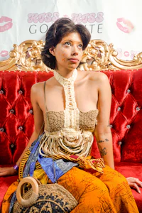 a woman sitting on a red couch