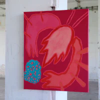 a red and blue painting hanging on a wall