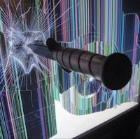 an image of a shattered screen with a gun in it