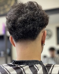 back view of a man with a curly haircut