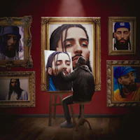 a man sitting on a stool in front of framed pictures