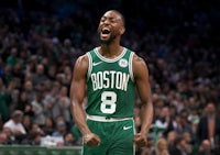 a boston celtics player is celebrating during a game