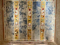 an egyptian bench in a room