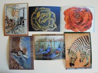 a group of paintings on a wall