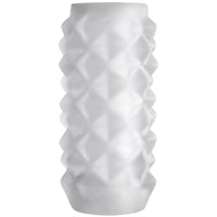 a white vase with a geometric design on it