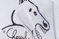 a t - shirt with a drawing of a horse on it