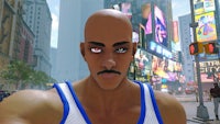 a man with a mustache is taking a picture in a city