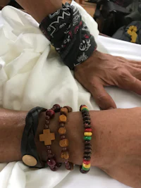 two people with bracelets on their hands