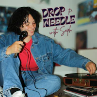a woman holding a record player