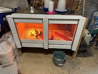 a chicken coop in a garage