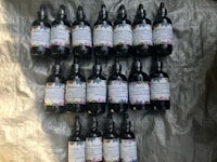 a group of bottles of essential oils on a table