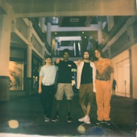 a group of people standing in a hallway