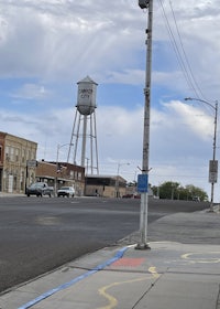 a city street with a water tower