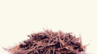a pile of dried leaves on a white background