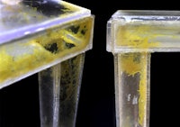 a pair of clear plastic stools with yellow paint on them